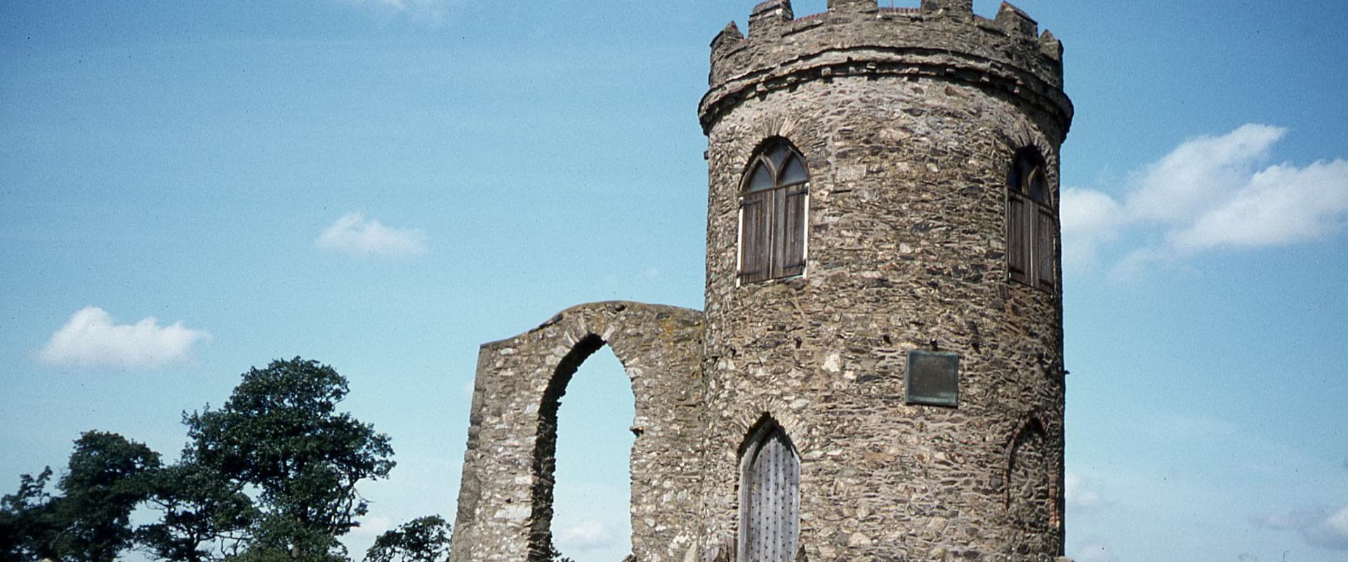 Old John Tower's ruined folly atop the hill in Bradgate Park on a clear day