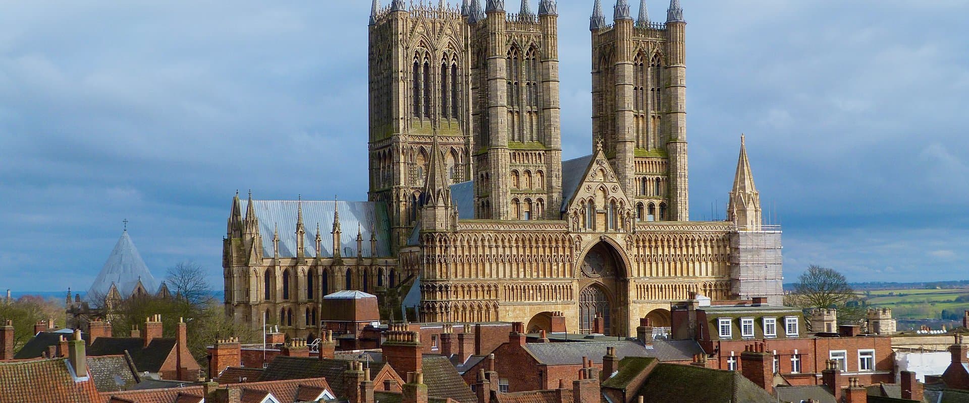 Lincoln Cathedral's three Gothic towers, seen from Lincoln Castle over the old town's rooftops
