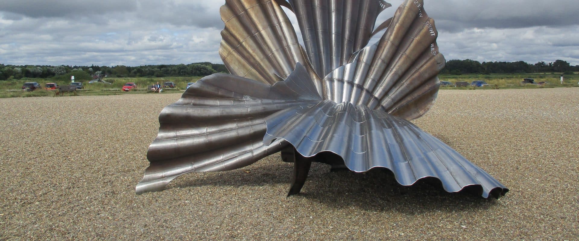 Maggi Hambling's steel Scallop sculpture standing on Aldeburgh's shingle beach, a tribute to composer Benjamin Britten