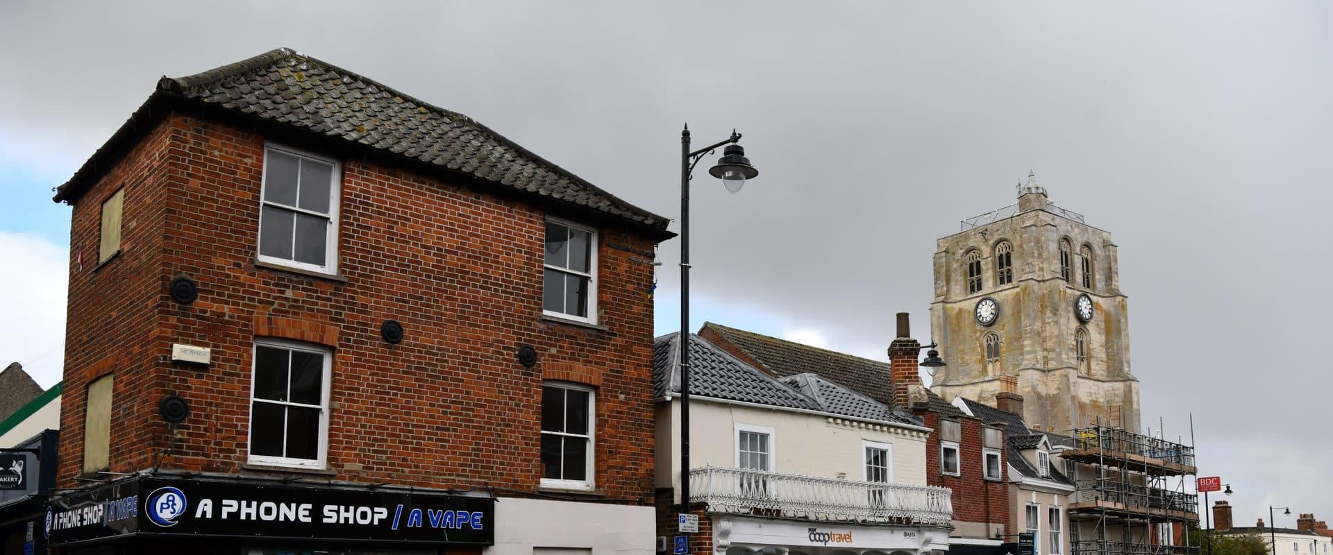 Beccles' New Market square lined with commercial buildings in the historic town centre
