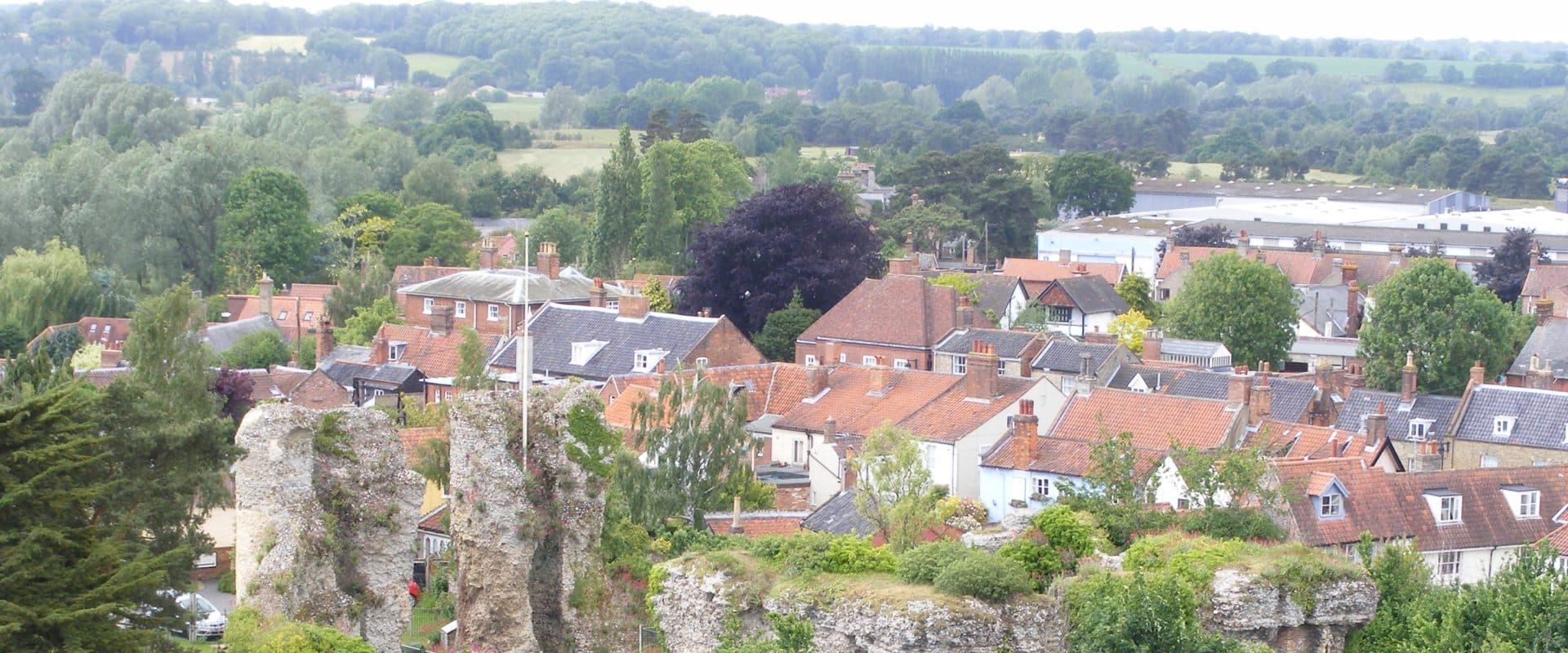 The twin-towered ruins of 12th-century Bungay Castle standing above the town
