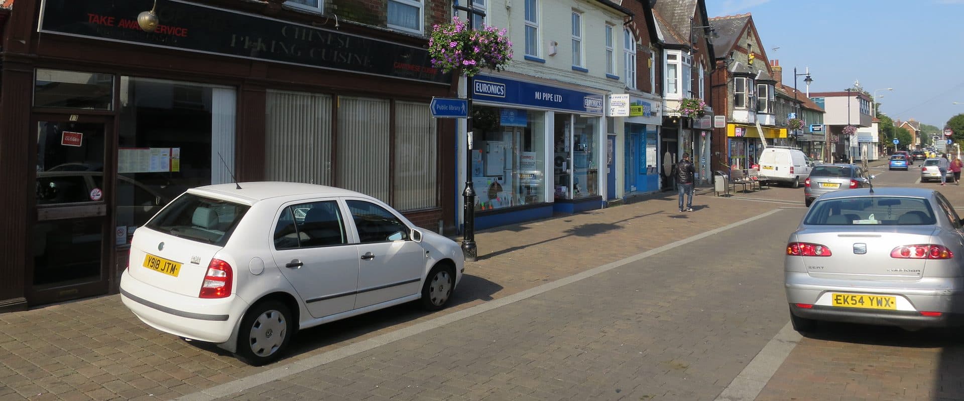 Shopfronts lining Queen Street in Haverhill's town centre