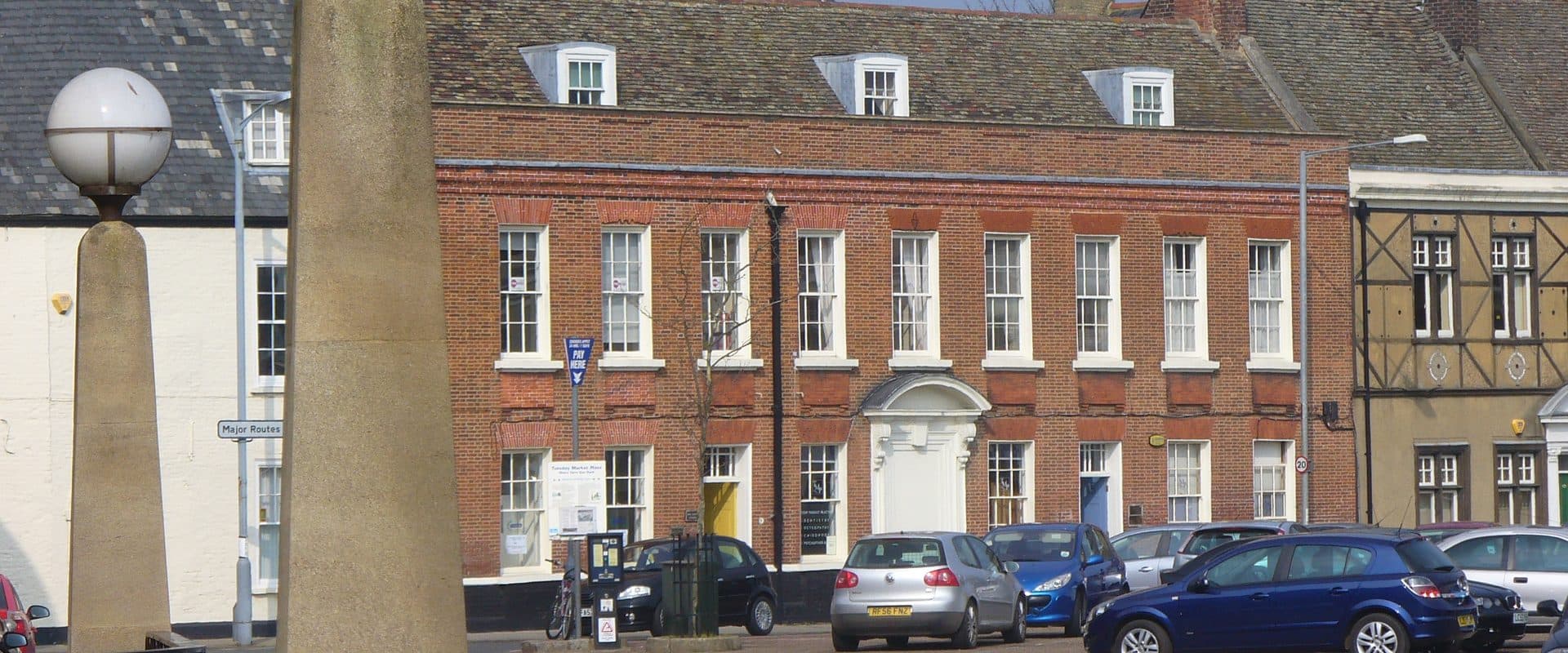 Tuesday Market Place in King's Lynn, lined with Georgian townhouses and shopfronts