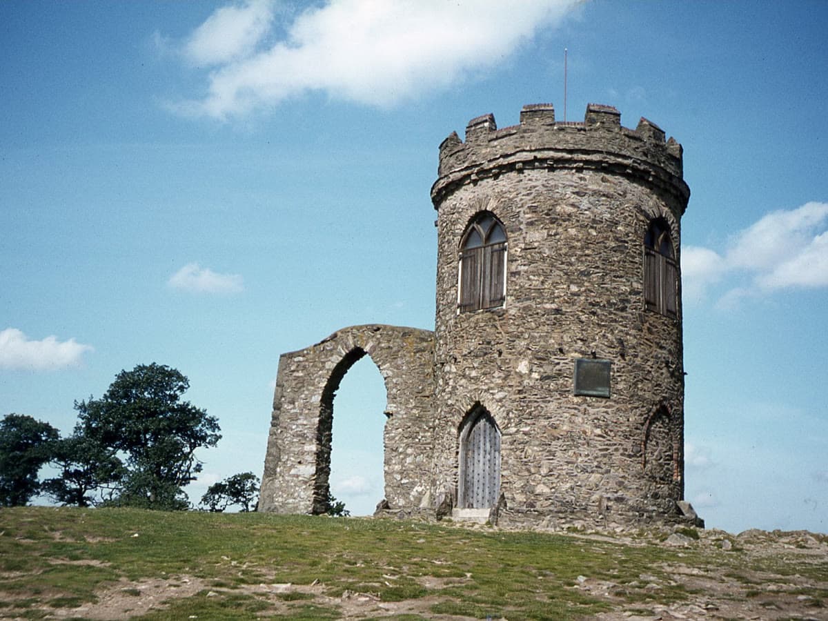 Old John Tower's ruined folly atop the hill in Bradgate Park on a clear day