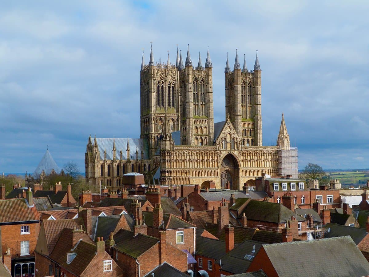 Lincoln Cathedral's three Gothic towers, seen from Lincoln Castle over the old town's rooftops