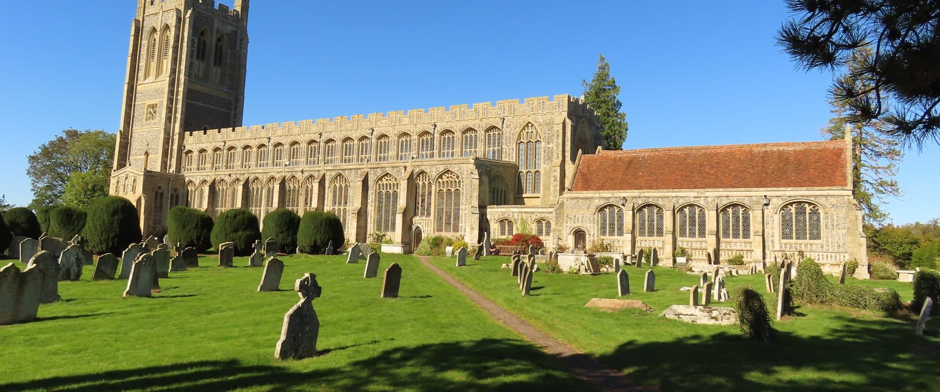 The flint-and-stone exterior of Holy Trinity Church, Long Melford, one of Suffolk's great "wool churches"