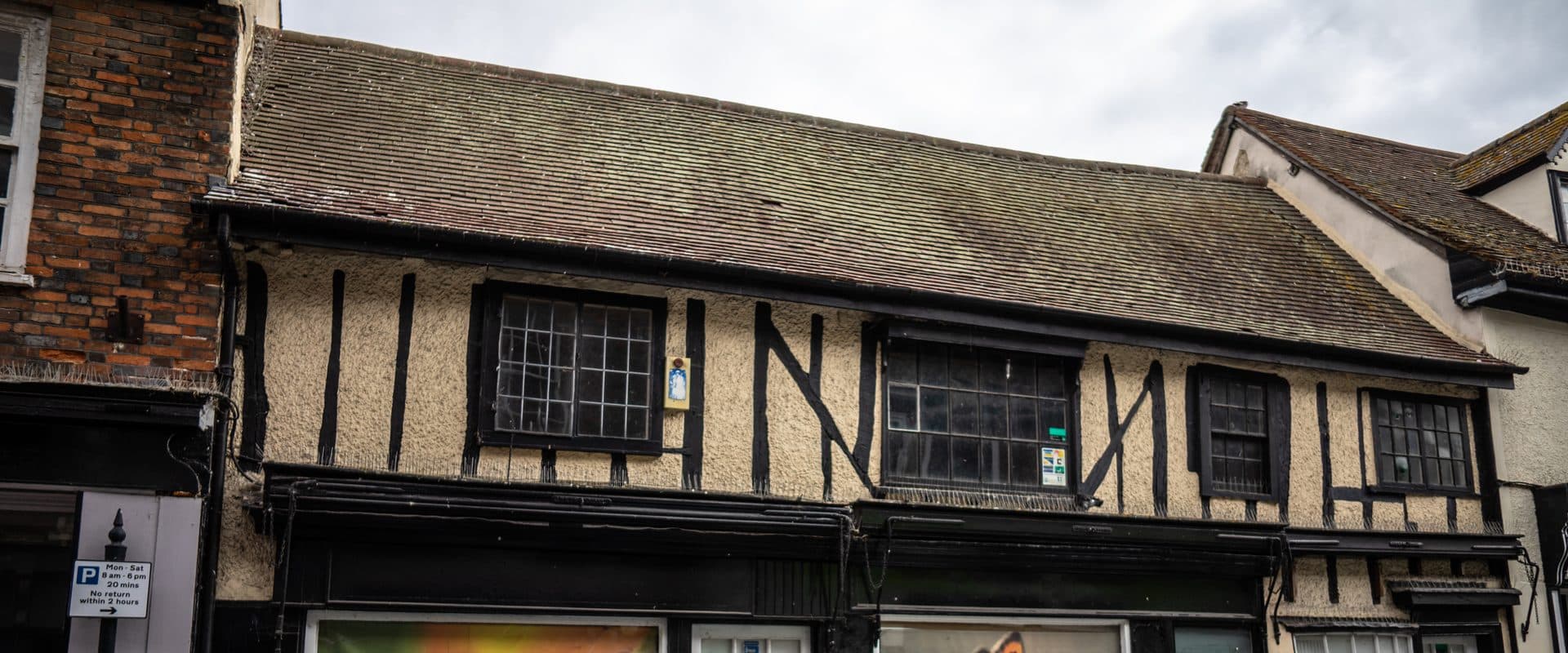 Historic listed buildings on the High Street in Royston, at the crossing of the Icknield Way and Ermine Street