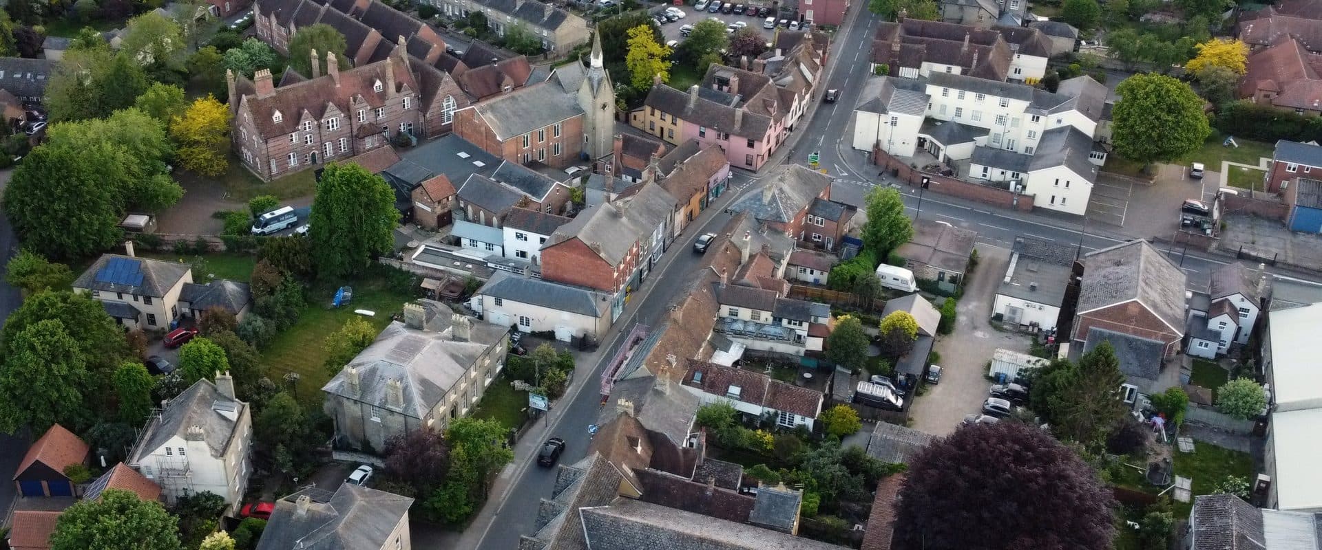 Drone view over Sudbury's Gainsborough Street and the converted Mill Hotel on the banks of the River Stour