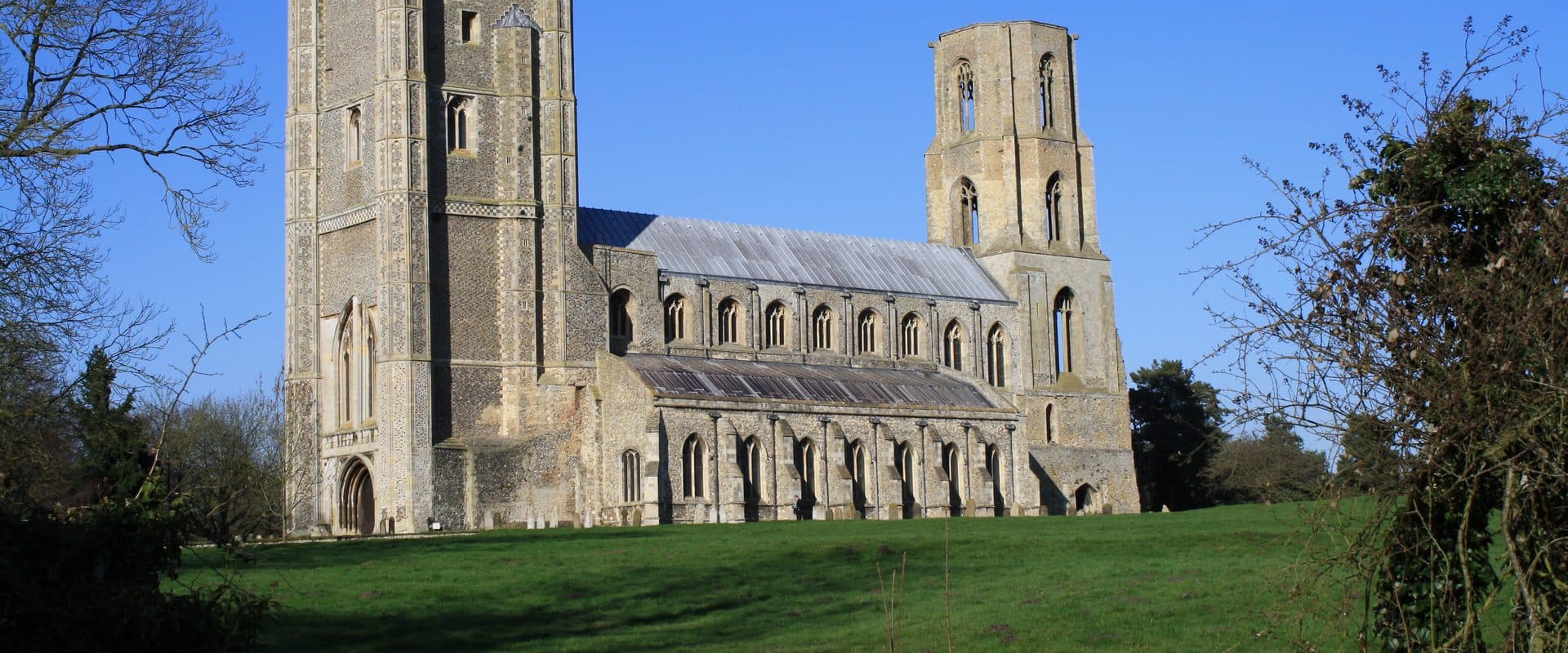 Wymondham Abbey seen across its meadow